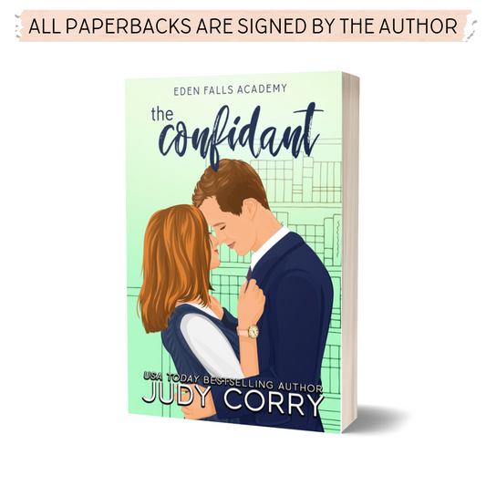 The Confidant Paperback cover featuring romantic couple embracing. Green background with bookshelf in the back.