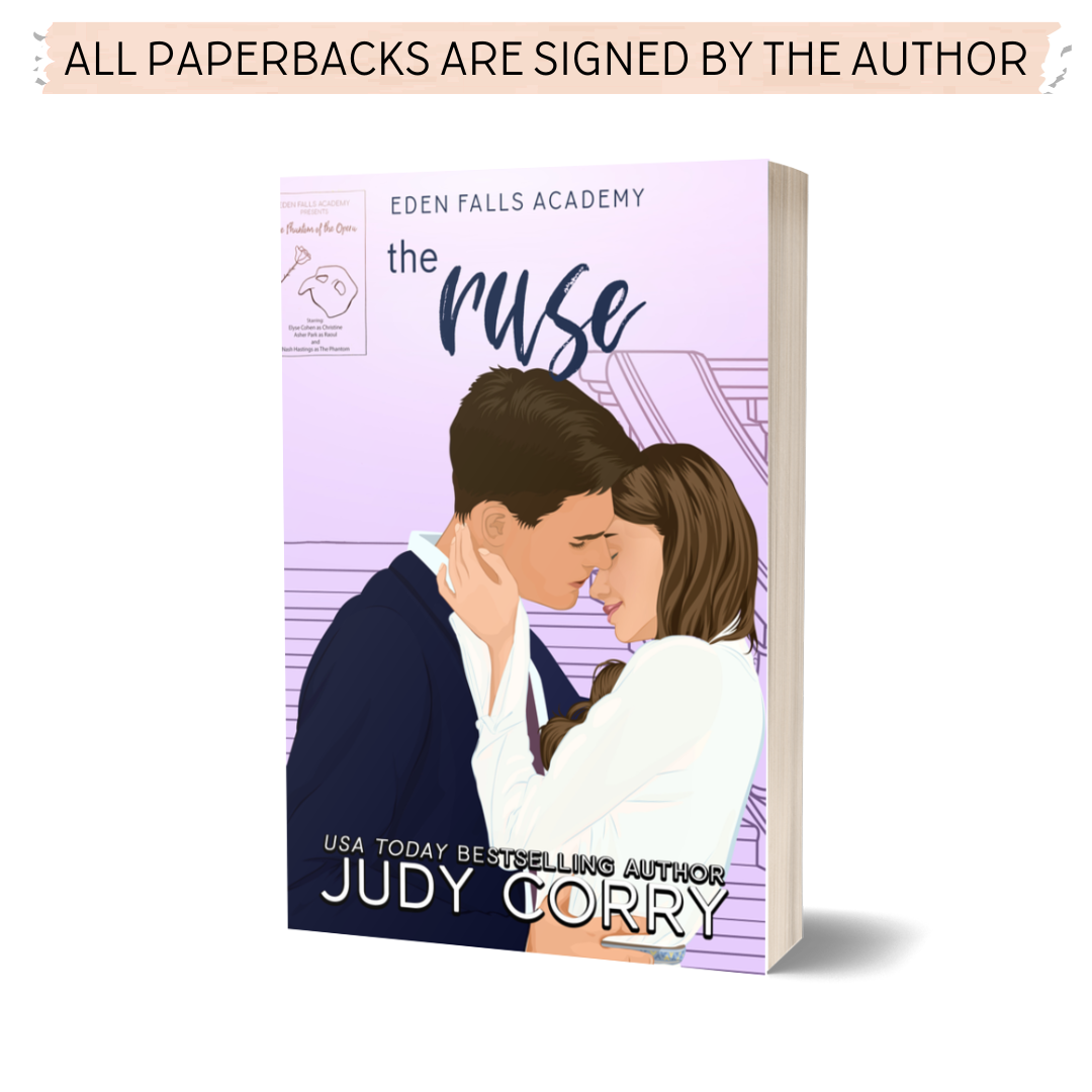 The Ruse paperback cover featuring a romantic couple embracing/almost kissing on a purple background with a Phantom of the Opera play poster in the background.