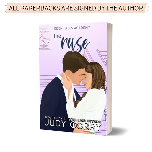 The Ruse paperback cover featuring a romantic couple embracing/almost kissing on a purple background with a Phantom of the Opera play poster in the background.